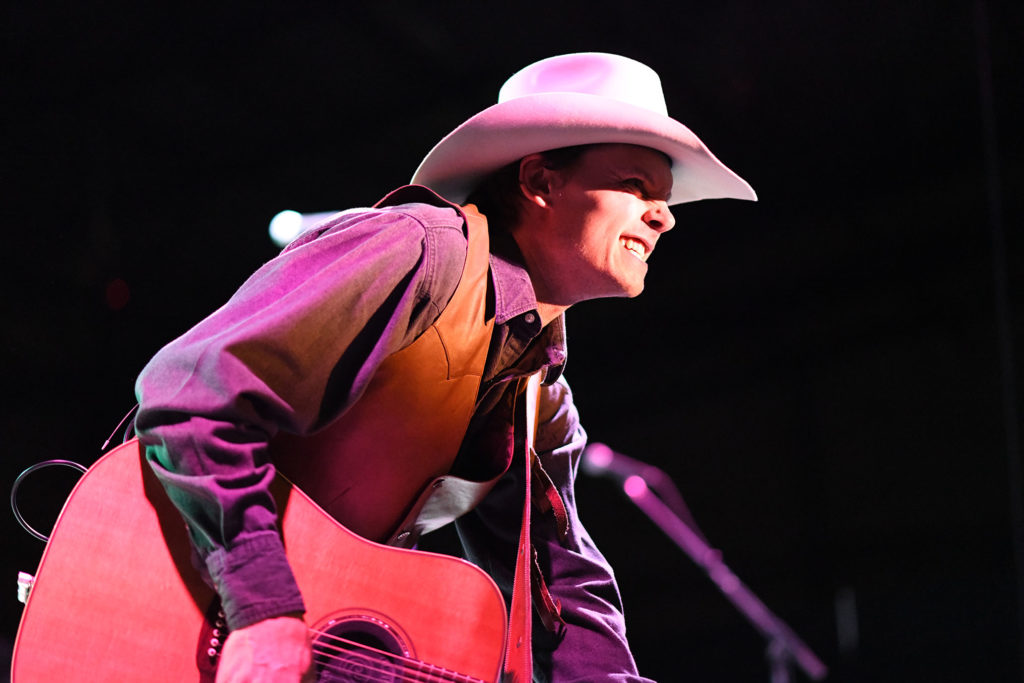 Photo of Ned LeDeoux performing on stage at Montrose County Event Center